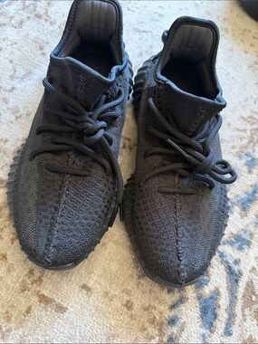 Authentic black Yeezy sneakers